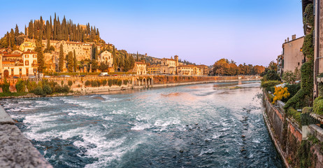 Panoramic view of the Adige river and San Pietro Castle on a hill in Verona, Italy.