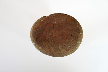 close up of a sand stone on white background