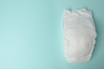 Baby diaper on light blue background, top view. Space for text