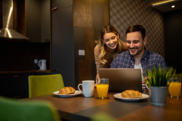 Couple shopping online at home