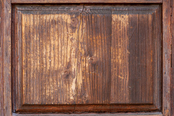 Closeup of a door made of old wood  brown color