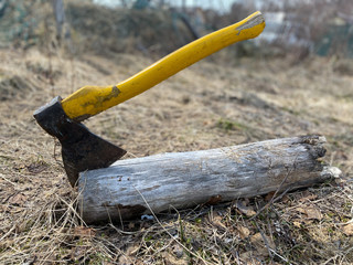 Hatchet Ax and Pile of Split Wood Logs for Fire, Selective Focus with Shallow Depth of Field, Toned...