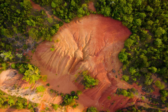 Hungary Gant. Abandocned Bauxite mine. Planet Mars mood. orange and red colors on the  ground everywhere. Apocaliptic sight.