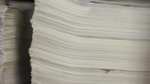 Old business documents are stored in a pile in the archive. Old financial statements.