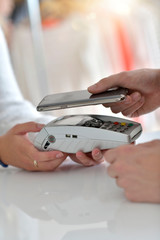 Closeup of payment with smartphone