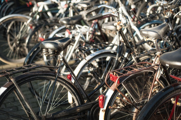 Fototapeta na wymiar Close-up detail view of old holland vintage classic bicycles. Cityscape view. Dutch lifestyle