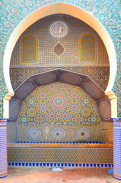Beautiful Nejjarine Fountain in the Medina of Fes, Morocco with intrigue pattern and mosaic tiles.