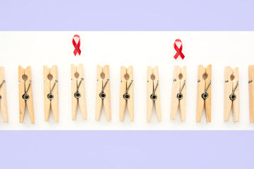  World HIV AIDS Prevention spread	 -clothespins symbolize people  one with Red ribbon as immune deficiency syndrome 