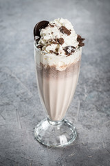 Chocolate milkshake with chocolate chip cookies in a glass