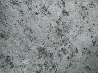 Old gray painted concrete with black scuffed rustic background, horizontal orientation, top view. Copy space.
