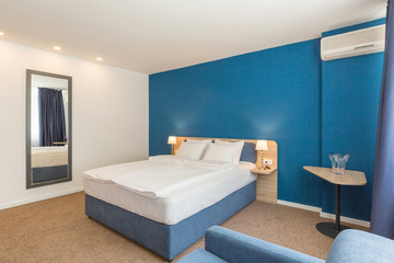 Apartment interior, bedroom with blue wall