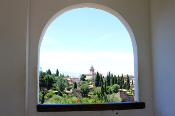 Views of the Alhambra in Granada from an arch (Andalusia, Spain)