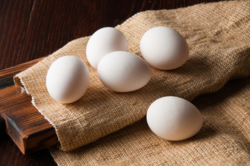 Chicken eggs on burlap, rustic still life