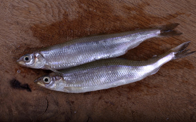 Smelt fish on cutting board
