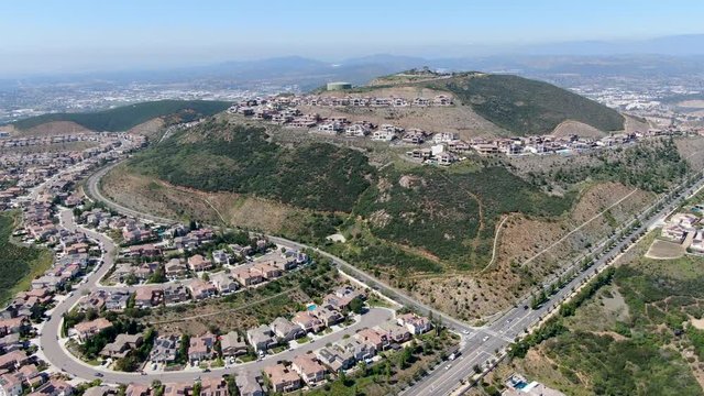 Aerial view of upper middle class neighborhood with big villas around Double Peak Park in San Marcos, California, USA.