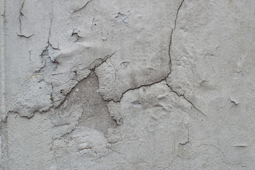 The wall's color is peeling, there are color cracks.