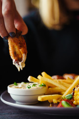 Buffalo chicken wings dip with french fries