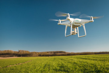 drone quad copter on green corn field