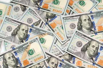 several dollar bills on a white background