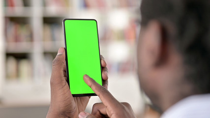 Rear View of African Man using Smartphone, Chroma Screen