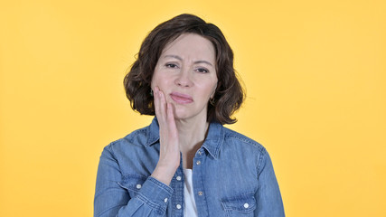 Old Woman with Toothache on Yellow Background