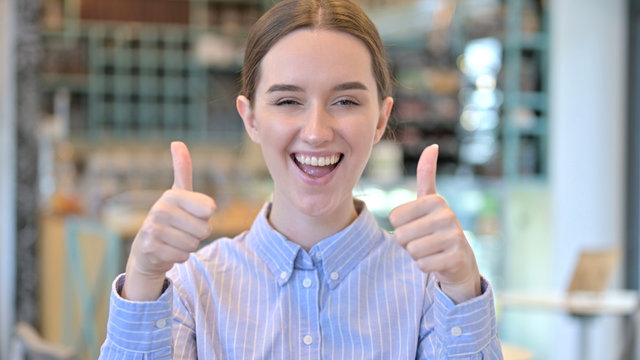 Portrait of Motivated Young Woman Cheering, Tumbs Up
