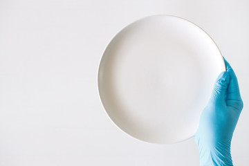 hand in medical glove, blue color, concept of protection against viruses