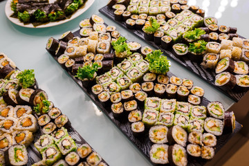 Different rolls background. Traditional sushi. Delicious japanese food.