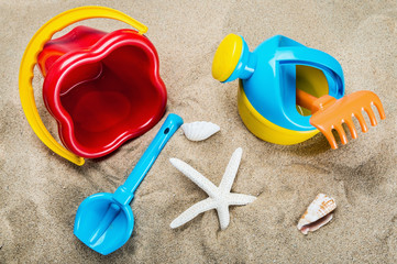 Fototapeta na wymiar children's toys for playing on the beach on the sea sand