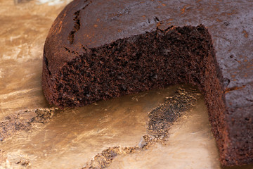 Close up view of chocolate cake on antique marble table