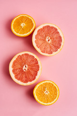 Slices of fresh orange and grapefruit on white background top view. Citrus Juice Concept, Vitamin C, Fruits. Creative summer background
