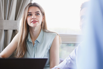 Business woman discussing with an opponent on the dialogue in a cafe discussing problems recalling...