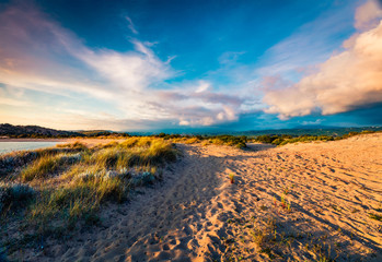 Dramatic summer view of Voidokilia beach. Scenic sunrise on Ionian Sea, Pilos town location, Greece, Europe. Beauty of nature concept background.