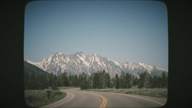POV Driving through the Grand Teton National Park. VINTAGE FILM