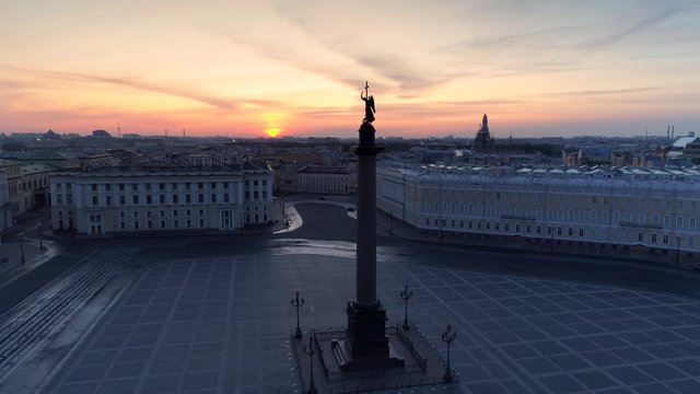 Flight forward St. Petersburg Alexandria column palace sunset sun square. Angel cross dark silhouette. Historic downtown beautiful cityscape. Nobody here. Skyline horizon. Travel tourism sight. Aerial