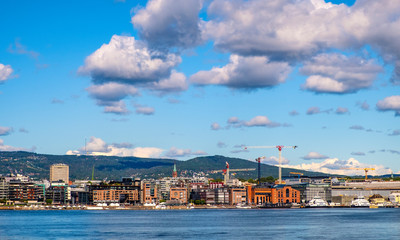 Oslo, Norway - Modern Aker Brygge borough of Oslo with yachts and piers at Oslofjord sea waterfront