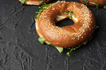 Healthy snack. Bagels with salmon and arugula