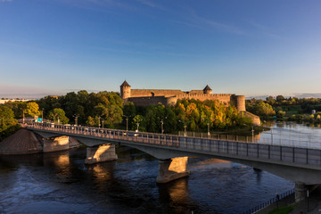 Obraz premium Russia, Ivangorod. Panoramic view of the Ivangorod fortress on the border of Russia and Estonia on the banks of the Narva River