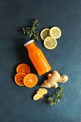Ginger shot with citrus fruits juice, turmeric and honey. Flat layot, copy space