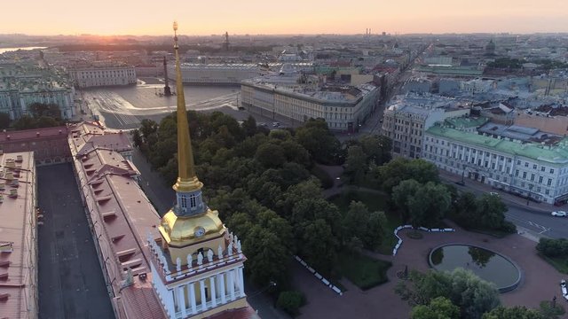Aerial desert no one central cityscape St. Petersburg Russia main Admiralty ship steeple city symbol. Winter palace square, rostral column. Historical streets. Road traffic. Scenic sunrise horizon. 4k
