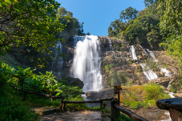 Fototapeta premium Beautiful landscape view of waterfall in Thailand in natural park with blue sky