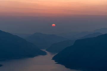 Landscape view of beautiful sunrise on big river and mountain view point