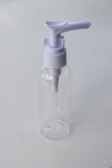 White transparent bottle for soap and cream on a white background.