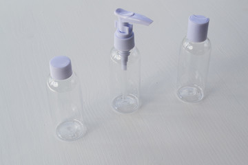 White transparent bottle for soap and cream on a white background.