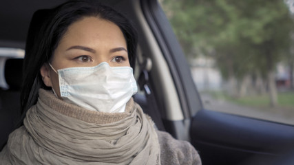 Woman drives a personal vehicle while shopping for food