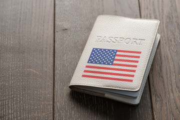 Close up on a USA passport on wooden background