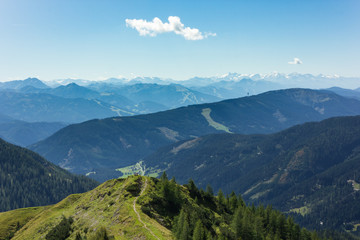 Naklejka na ściany i meble Beautiful Austrian alpine landscape scenery during summer with several mountain ranges in the distance