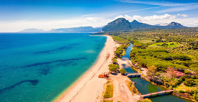 View from flying drone. Panoramic morning view of Osala Beach. Colorful summr scene of Sardinia island, Italy, Europe. Wonderful seascape of Mediterranean sea. Traveling concept background.
