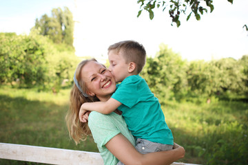 Happy loving mother and son  playing and hugging. Family walk. Happy Mothers day.
