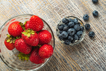 Blueberries and strawberries are prepared for breakfast. Healthy eating